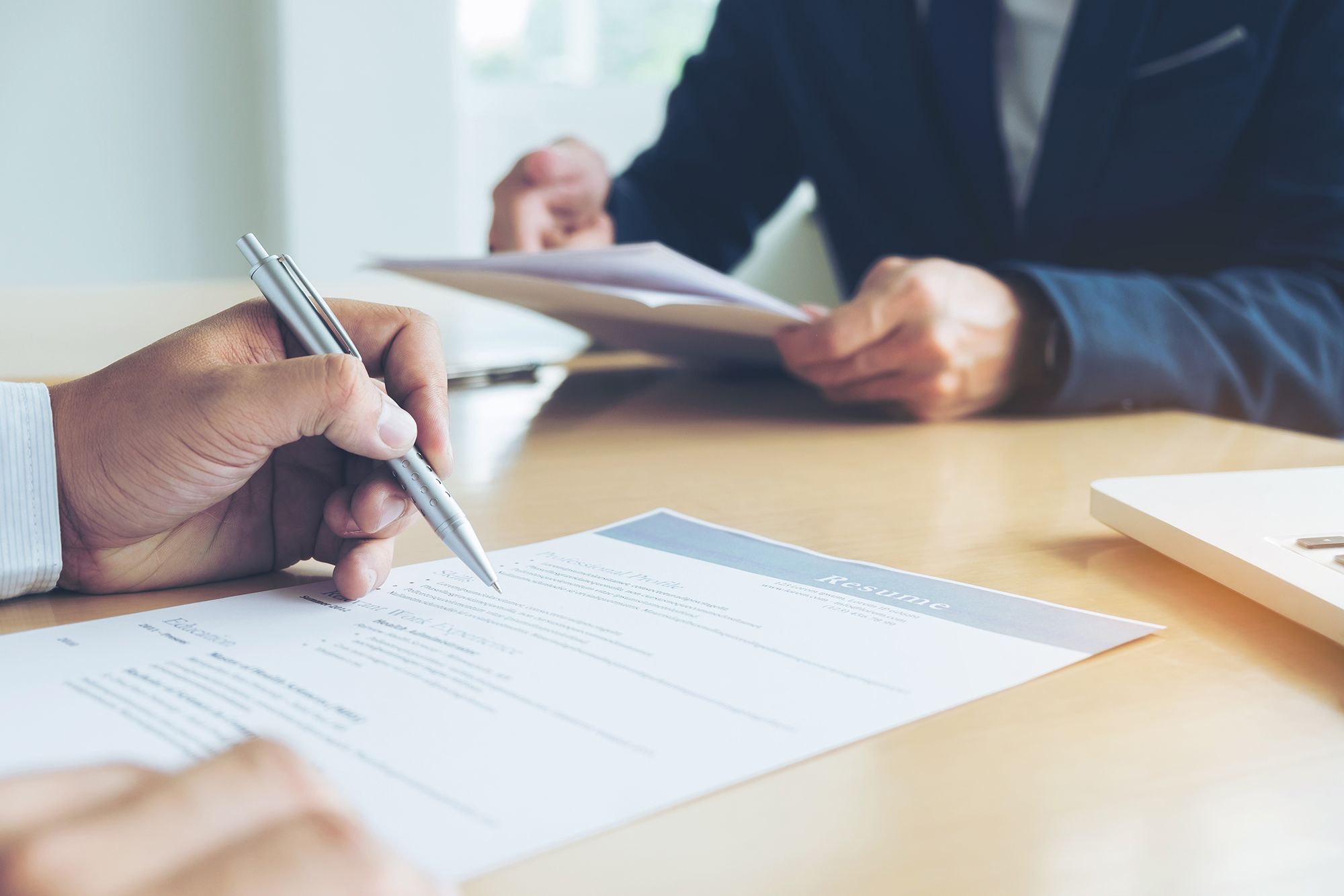 Man filling out resume